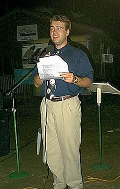 Chris Greene leads singing at the open air service