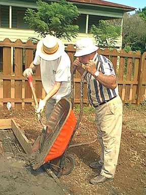 Jim N. and Larry man the wheelbarrow