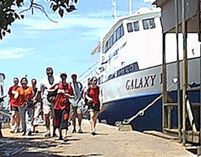 The team arrives by boat