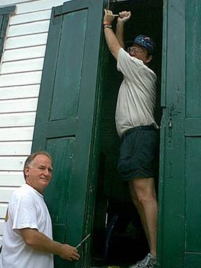 Bill and Buzzy work on the door.