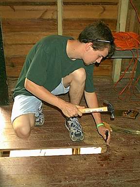 Mike replaces a termite-ridden floor board